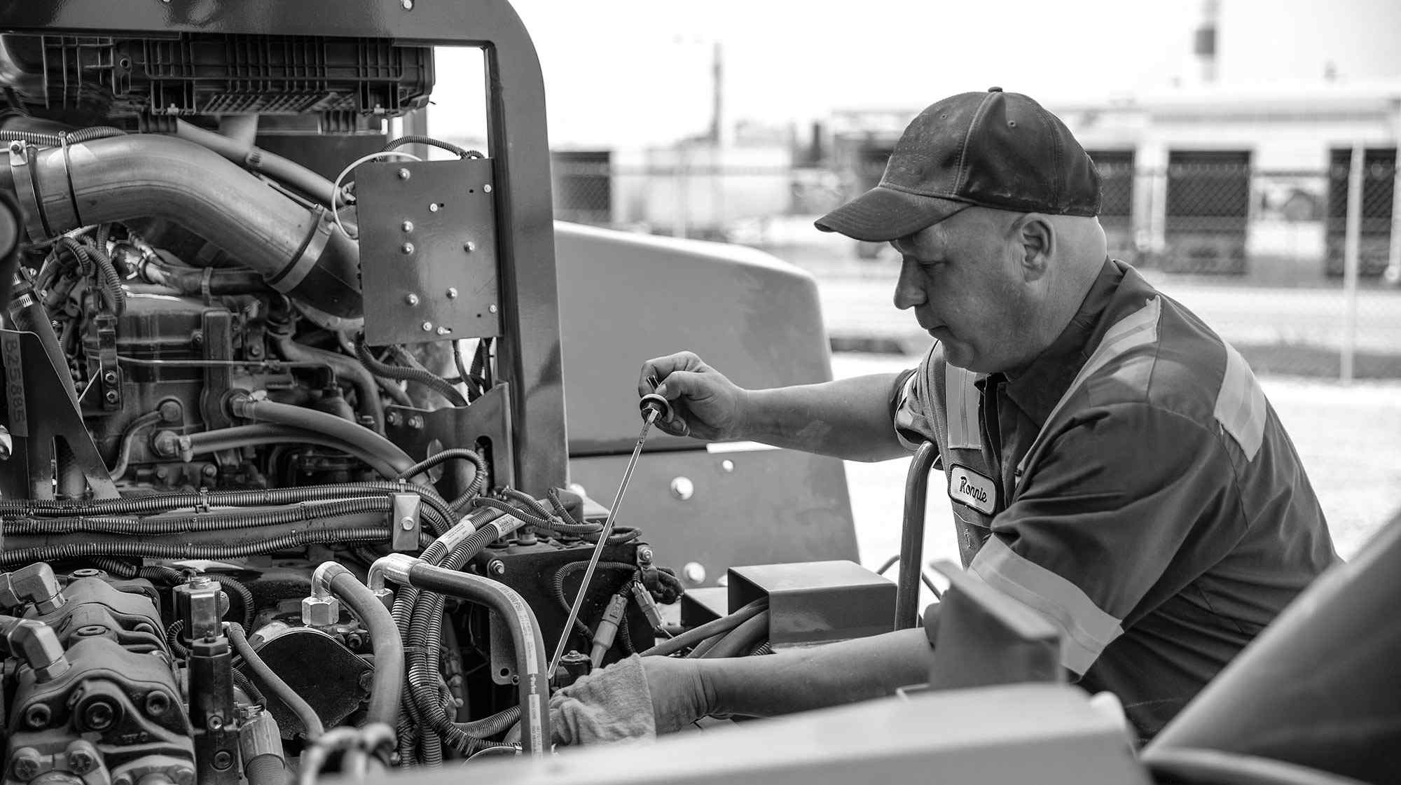 Technician working on a High-Capacity Core IC Pneumatic Forklift 